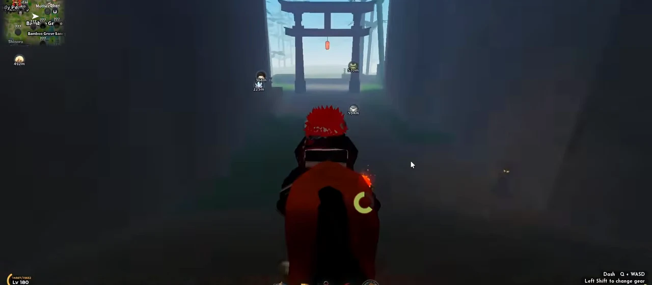 Riding up a misty path toward a torii